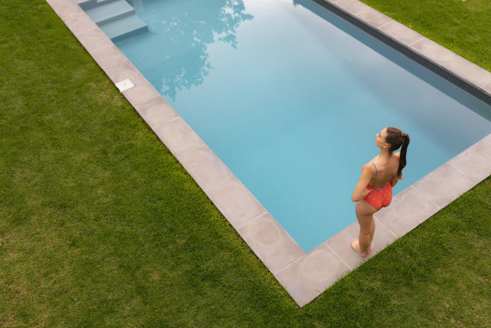 Professional pool installation showcasing crystal clear water and modern design in a luxurious backyard setting